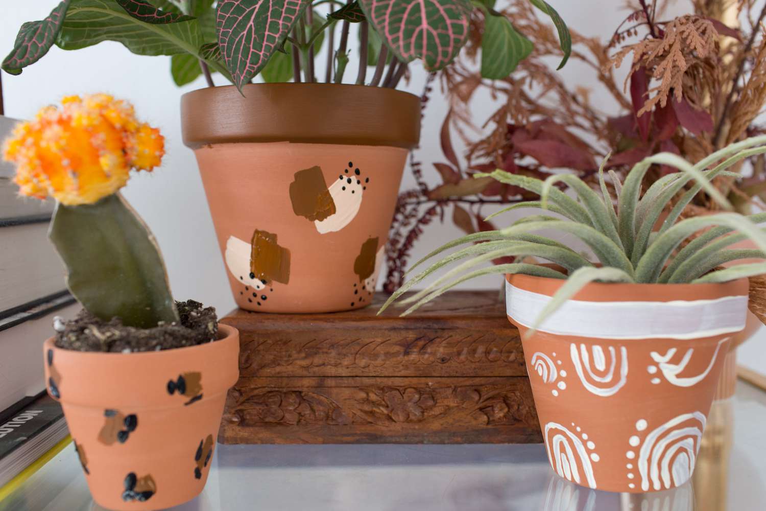 A collection of Beautiful handpainted ceramic plant pots.